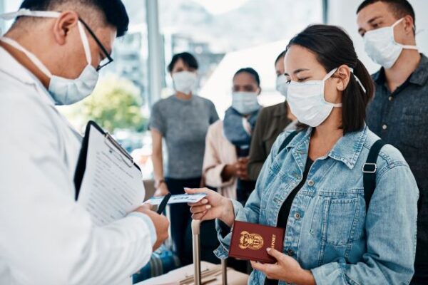 shot-of-a-woman-wearing-a-mask-and-giving-her-pass-2023-11-27-05-29-18-utc.jpg